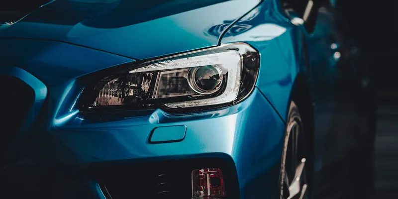 Rear quarter of a blue car beading water after the Signature Ceramic wash